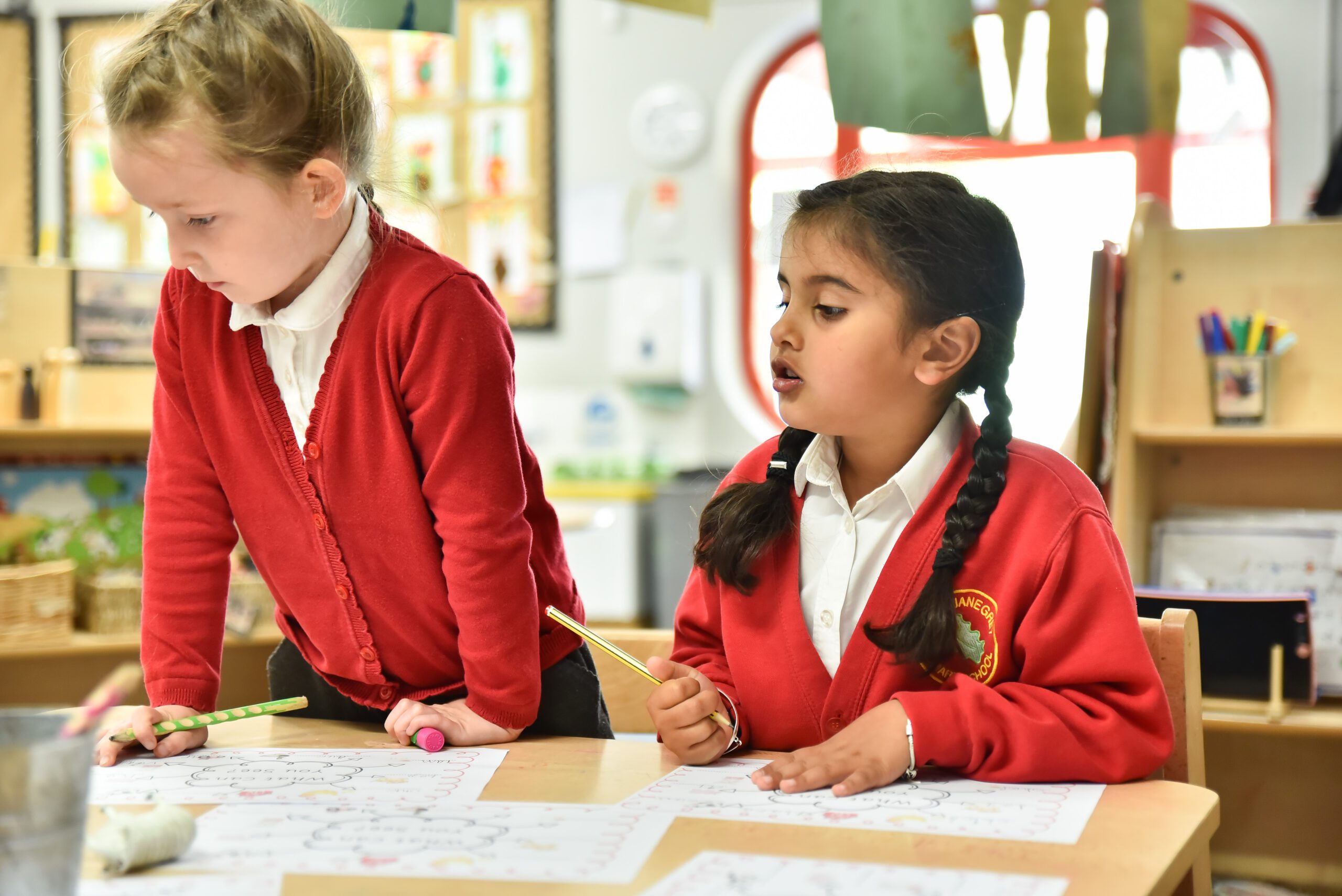 children writing together